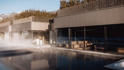 Photos from your hotel in Pfalzen in Val Pusteria/Pustertal Modern spa area with steam bath and hot outdoor pool in winter mountains