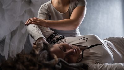 Photos from your hotel in Pfalzen in Val Pusteria/Pustertal Woman receiving shoulder stretch therapy from therapist in calm setting