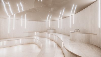Photos from your hotel in Pfalzen in Val Pusteria/Pustertal Modern bright spa steam room with curved marble benches and vertical lights