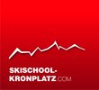 Logo der Skischule Kronplatz mit weißem Bergumriss auf rotem Hintergrund