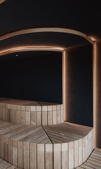 Modern wooden bench sauna with indirect LED lighting