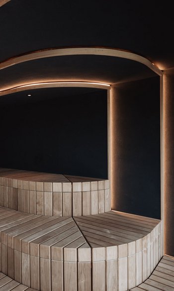Modern wooden bench sauna with indirect LED lighting