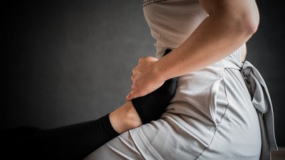 Photos from your hotel in Pfalzen in Val Pusteria/Pustertal A person stretching a leg during massage or physical therapy