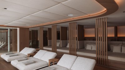 Cozy relaxation room with padded loungers and wooden panels