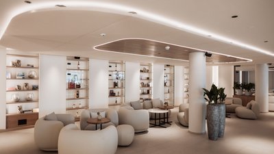 Moderne Lounge mit bequemen Sesseln und indirekter Deckenbeleuchtung