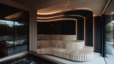 Photos from your hotel in Pfalzen in Val Pusteria/Pustertal Modern sauna room with wooden benches and indirect ceiling lighting