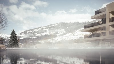 Photos from your hotel in Pfalzen in Val Pusteria/Pustertal Winter landscape with snowy mountains and modern building beside steaming water
